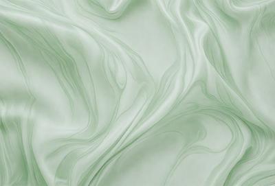 The primary subject of the image is a green, flowing, and swirling pattern. The setting is a green background, which adds to the overall atmosphere. The visual style is a combination of a photo and digital art, creating a unique and captivating image. The colors and mood convey a sense of movement and fluidity, with the green hue adding a sense of tranquility and natural beauty.