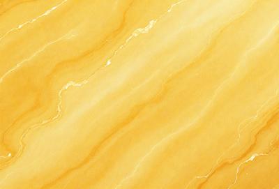 The primary subject of the image is a yellow marble wall with a pattern of swirls. The setting is a room with a yellow marble floor, and the visual style is a close-up of the marble wall. The colors and mood of the image are warm and inviting, with the yellow marble creating a sense of luxury and elegance.