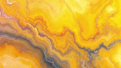 The primary subject of the image is a yellow and orange swirling pattern, which appears to be a painting or a digital artwork. The setting is a yellow and orange background, which complements the vibrant colors of the swirling pattern. The visual style is a mix of digital art and painting, creating a unique and eye-catching piece. The dominant colors in the image are yellow and orange, giving it a warm and lively atmosphere.