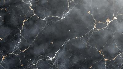 The primary subject of the image is a marble countertop with a black background. The setting is a kitchen or bathroom, as the countertop is a common feature in these spaces. The visual style is a close-up of the marble countertop, showcasing its texture and details. The colors and mood of the image are predominantly black and white, giving it a classic and elegant appearance.