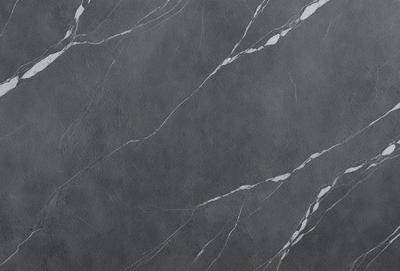 The primary subject of the image is a gray marble wall with a pattern of white lines. The setting is a room with a gray background. The visual style is a close-up of the marble wall, showcasing its texture and pattern. The colors and mood of the image are predominantly gray, giving it a calm and sophisticated atmosphere.