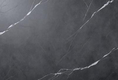 The primary subject of the image is a gray marble wall. The setting is a room with a gray marble floor. The visual style is a close-up of the marble wall, showcasing its texture and pattern. The colors and mood of the image are predominantly gray, giving it a calm and sophisticated atmosphere.