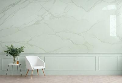 The primary subject of the image is a white chair placed in a room with a green wall. The chair is positioned in front of the wall, and there is a potted plant nearby. The setting appears to be a living room or a similar indoor space. The visual style of the image is a photo, capturing the chair and the green wall in detail. The colors and mood of the image are predominantly green, with the green wall and the potted plant adding a sense of calmness and relaxation to the scene