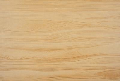 The image features a wooden surface with a unique and intricate pattern. The wooden surface appears to be a table or a piece of furniture, and the pattern is reminiscent of a wood grain. The colors in the image are predominantly brown, which adds to the warm and natural atmosphere of the scene. The visual style of the image is a close-up of the wooden surface, highlighting the intricate pattern and texture.