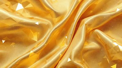 The primary subject of the image is a gold fabric with a pattern of triangles. The setting is a close-up of the fabric, showcasing its texture and pattern. The visual style is a combination of a photo and digital art, as the gold fabric appears to be a digital creation. The colors and mood of the image are warm and luxurious, with the gold fabric creating a sense of sophistication and elegance.