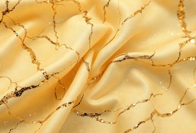 The primary subject of the image is a yellow cloth with gold glittery patterns on it. The setting is a close-up of the cloth, showcasing its intricate design. The visual style is a combination of a photo and digital art, creating a unique and eye-catching pattern. The colors and mood of the image are warm and vibrant, with the gold glittery patterns adding a touch of luxury and sophistication.