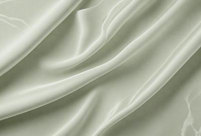 The primary subject of the image is a white sheet of fabric, which is the main object, scene, or focus of the image. The setting or background is a white sheet of fabric, and the visual style is a photo. The colors and mood of the image are predominantly white, giving it a clean and minimalist appearance.