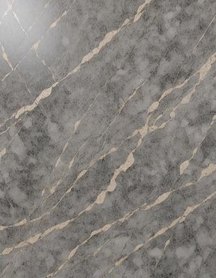 The primary subject of the image is a marble countertop with a patterned design. The setting is a kitchen, and the visual style is a close-up of the countertop. The colors and mood of the image are predominantly gray, giving it a sophisticated and elegant appearance.