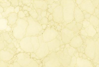 The image features a yellow and white marbled wallpaper with a textured appearance. The wallpaper has a yellow background with white speckles, giving it a unique and eye-catching look. The pattern of the wallpaper creates a visually interesting and somewhat rustic atmosphere.