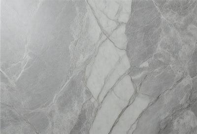 The primary subject of the image is a marble tile with a white and grey color scheme. The setting is a bathroom, as indicated by the presence of the marble tile. The visual style is a close-up of the marble tile, showcasing its texture and pattern. The colors and mood of the image are predominantly neutral, with a touch of elegance and sophistication.