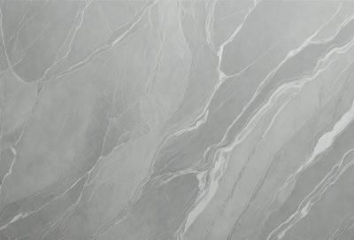 The image features a large, gray marble wall with a patterned texture. The wall appears to be made of marble, giving it a luxurious and elegant appearance. The pattern on the wall adds visual interest and depth to the overall design.