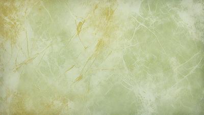 The primary subject of the image is a yellow and green wall with a patterned texture. The setting is a room with a green wall, and the visual style is a close-up of the wall. The dominant colors are yellow and green, creating a warm and inviting atmosphere.
