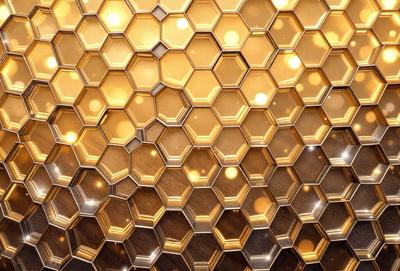 The primary subject of the image is a close-up of a honeycomb pattern, showcasing the hexagonal structure of the honeycomb. The setting is a golden background, which adds a warm and inviting atmosphere to the scene. The visual style is a combination of a photo and digital art, creating a unique and intricate pattern. The colors and mood of the image are predominantly golden and warm, evoking a sense of natural beauty and harmony.