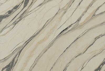 The primary subject of the image is a marble tile with a pattern of swirls and stripes. The setting is a wall, and the visual style is a close-up of the tile. The colors and mood of the image are predominantly white and gray, giving it a clean and elegant appearance.