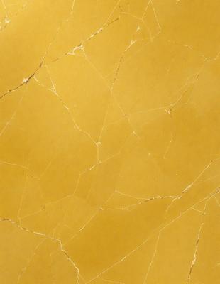 The primary subject of the image is a yellow wall with a textured surface. The setting is a room with a yellow wall, and the visual style is a close-up of the wall. The dominant colors are yellow, and the overall atmosphere is warm and inviting.