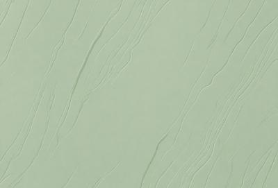 The primary subject of the image is a green wall with a pattern of long, thin lines. The setting is a room with a green wall, and the visual style appears to be a patterned wallpaper. The colors and mood of the image are predominantly green, creating a calm and soothing atmosphere.