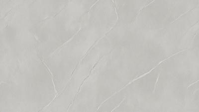 The primary subject of the image is a white marble wall with a pattern of cracks and crevices. The setting is a room with a white background, and the visual style is a close-up of the marble wall. The colors and mood of the image are predominantly white, giving it a clean and elegant appearance.