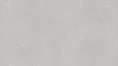The primary subject of the image is a white wall with a cracked texture. The setting is a room with a white background. The visual style is a close-up of the wall, showcasing its texture and appearance. The colors and mood of the image are predominantly white, giving it a clean and minimalist appearance.
