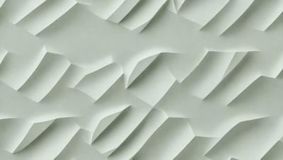 The primary subject of the image is a large, textured wall made of paper. The setting is a room with a green background, and the visual style is a close-up of the paper wall. The colors and mood of the image are predominantly green, giving it a calm and soothing atmosphere.