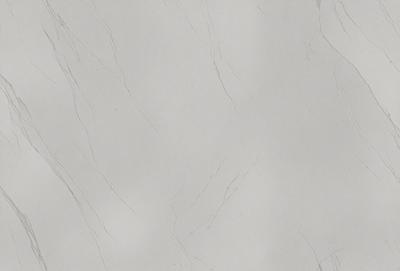 The primary subject of the image is a white marble wall. The setting is a room with a white marble wall as the main focus. The visual style is a photo of the marble wall. The colors and mood of the image are predominantly white, giving it a clean and elegant appearance.
