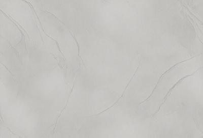 The primary subject of the image is a white wall with a textured surface. The setting is a room with a white background. The visual style is a close-up of the wall, showcasing its texture and appearance. The colors and mood of the image are predominantly white, giving it a clean and minimalist appearance.