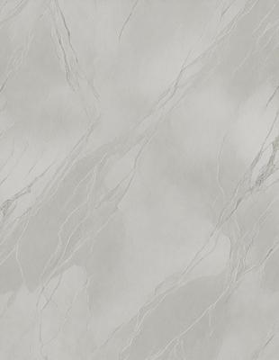 The primary subject of the image is a white marble wall with a pattern of white and grey veins. The setting is a room with a white marble floor. The visual style is a close-up of the marble wall, showcasing its unique texture and pattern. The colors and mood of the image are predominantly white and grey, giving it a clean and elegant appearance.