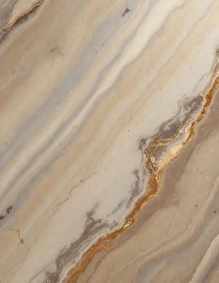 The primary subject of the image is a marble surface with a gold-colored streak running through it. The setting is a marble countertop, and the visual style is a close-up of the marble surface. The colors and mood of the image are predominantly neutral, with the gold streak adding a touch of warmth and sophistication to the overall appearance.