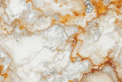 The primary subject of the image is a marble wall with a unique, orange-red pattern. The setting is a room with a white marble floor, which complements the marble wall. The visual style of the image is a close-up of the marble wall, showcasing its intricate design. The dominant colors in the image are orange and red, creating a warm and vibrant atmosphere.