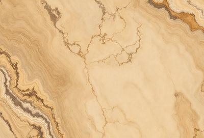 The primary subject of the image is a marble countertop with a unique pattern. The setting is a kitchen or bathroom counter, and the visual style is a close-up of the marble surface. The colors and mood of the image are warm and natural, with the marble providing a sense of luxury and elegance.