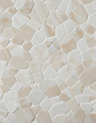 The primary subject of the image is a white tile wall with a pattern of white and tan tiles. The setting is a room with a white tile wall as the main focus. The visual style is a close-up of the tile wall, showcasing the intricate pattern of the tiles. The colors and mood of the image are predominantly white and neutral, creating a clean and simple atmosphere.