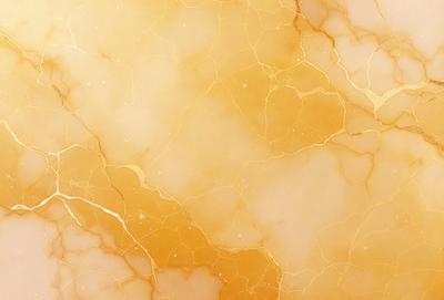 The primary subject of the image is a marble surface with a yellowish hue. The setting is a room with a marble wall, and the visual style is a close-up of the marble surface. The colors and mood of the image are warm and inviting, with the yellowish hue of the marble creating a sense of warmth and natural beauty.