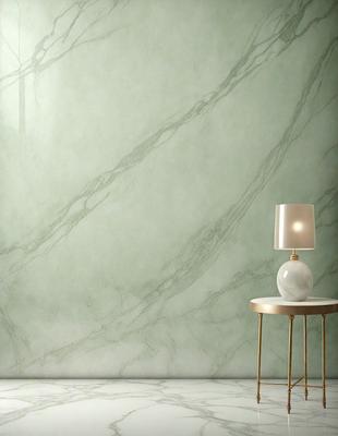 The primary subject of the image is a white lamp with a gold base, placed on a table. The setting is a room with a green marble wall, which serves as the background. The visual style is a photo, capturing the lamp and the wall in detail. The colors and mood of the image are predominantly white and green, creating a calm and serene atmosphere.