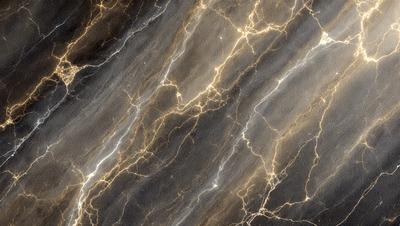 The primary subject of the image is a marble countertop with a pattern of light and dark streaks. The setting is a kitchen, and the visual style is a close-up of the marble countertop. The colors and mood of the image are predominantly dark, with the light and dark streaks creating a contrasting pattern.