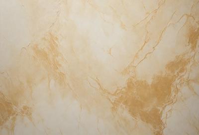 The primary subject of the image is a marble wall with a gold-colored pattern. The setting is a room with a white background. The visual style is a close-up of the marble wall, showcasing its intricate design. The colors and mood of the image are warm and elegant, with the gold pattern adding a touch of luxury to the overall atmosphere.