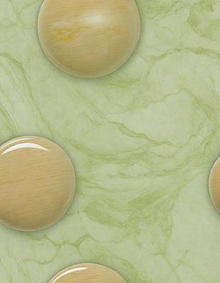 The primary subject of the image is a group of three wooden balls placed on a green marble surface. The setting is a countertop or table, and the visual style appears to be a photo. The colors and mood of the image are predominantly green, with the marble surface and the wooden balls creating a natural and calming atmosphere.