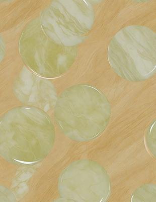 The primary subject of the image is a collection of green marble balls. These balls are arranged on a wooden surface, which serves as the setting and background of the scene. The visual style of the image is a close-up of the marble balls, showcasing their unique texture and color. The dominant colors in the image are green and brown, creating a natural and earthy atmosphere.