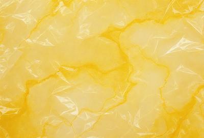 The primary subject of the image is a yellow wall with a pattern of yellow and brown. The setting is a room with a yellow wall, and the visual style is a close-up of the wall. The colors and mood of the image are warm and inviting, with the yellow and brown tones creating a cozy atmosphere.