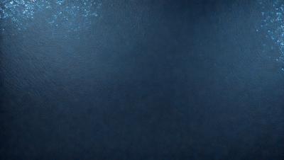 The primary subject of the image is a large, blue, textured surface. The setting appears to be a dark, underwater environment. The visual style of the image is a photo, capturing the unique texture and color of the blue surface. The dominant colors in the image are blue and black, creating a moody and mysterious atmosphere.