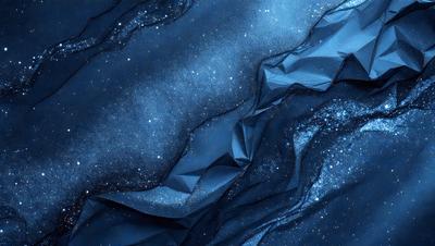 The primary subject of the image is a blue fabric with a pattern of stars on it. The setting is a dark background, which contrasts with the bright blue fabric. The visual style is a combination of a photo and digital art, creating a unique and eye-catching design. The colors and mood of the image are predominantly blue, with the stars adding a touch of white and a sense of depth to the fabric.