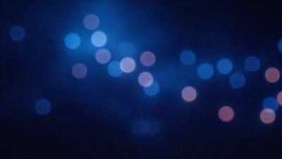 The primary subject of the image is a blue sky filled with bright, colorful lights. The setting is a nighttime sky, and the visual style appears to be a combination of a photo and digital art. The colors and mood of the image are vibrant and lively, with the blue sky and colorful lights creating a sense of excitement and energy.
