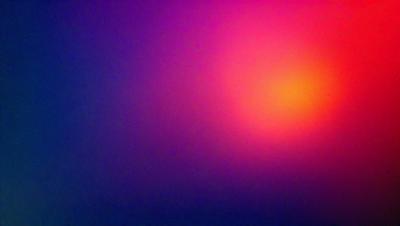 The primary subject of the image is a brightly colored, pinkish-orange background. The setting appears to be a dark, possibly purple, background. The visual style of the image is a close-up of the pinkish-orange background, which gives it a vibrant and lively appearance. The colors and mood of the image are energetic and lively, with the pinkish-orange background standing out against the darker purple background.