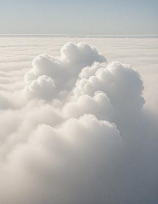 The primary subject of the image is a cloudy sky filled with numerous white clouds. The setting is a vast, open space with no visible landmarks or objects. The visual style is a natural, outdoor scene with a focus on the clouds and the sky. The colors and mood of the image are predominantly white and serene, creating a peaceful and tranquil atmosphere.