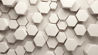 The primary subject of the image is a white tile wall with a pattern of hexagonal shapes. The setting is a room with a white tile floor, and the visual style is a close-up of the wall. The colors and mood of the image are predominantly white, giving it a clean and minimalist appearance.