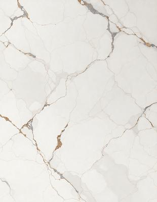 The primary subject of the image is a white marble tile with a gold-colored grout line. The setting is a bathroom, and the visual style is a close-up of the tile. The dominant colors are white and gold, creating a clean and elegant atmosphere.