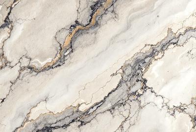 The image features a marble countertop with a unique design. The countertop has a mix of gray, white, and yellow colors, creating a visually appealing and natural-looking surface. The marble countertop is the primary subject of the image, showcasing its distinctive texture and appearance. The setting is a kitchen or bathroom, where the countertop is likely used for food preparation or as a decorative element. The visual style of the image is a close-up of the marble countertop, highlighting
