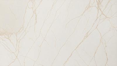 The primary subject of the image is a white marble wall with a pattern of lines and swirls. The setting is a room with a white background, and the visual style is a close-up of the marble wall. The colors and mood of the image are predominantly white, giving it a clean and elegant appearance.