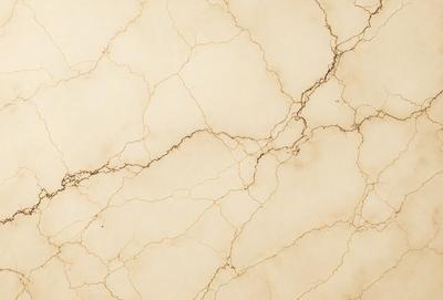 The primary subject of the image is a marble wall with a rough texture. The setting is a room with a white background. The visual style is a photo of the marble wall. The colors and mood of the image are predominantly white, giving it a clean and elegant appearance.