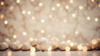 The primary subject of the image is a group of white balls, which are arranged in a line on a table. The setting is a white wall, and the visual style appears to be a photo. The dominant colors in the image are white and light, creating a clean and minimalist atmosphere.