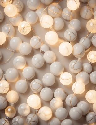 The primary subject of the image is a collection of white beads or marbles, which are arranged in a visually appealing manner. The setting is a white surface, which provides a clean and minimalist backdrop for the beads. The visual style of the image is a close-up of the beads, showcasing their intricate details and textures. The colors and mood of the image are predominantly white, giving it a calm and serene atmosphere.