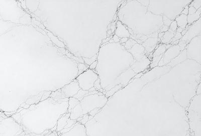The primary subject of the image is a white marble wall with a pattern of black lines. The setting is a white background, and the visual style is a photo. The colors and mood of the image are predominantly white, giving it a clean and minimalist appearance.